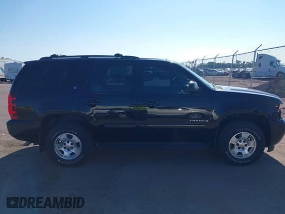 2009 Chevrolet Tahoe 2LT with VIN 1GNFK23079R260424, listed as a IAAI auction lot 43026277 with 253,109 mi miles and . Bid and sale history available at DreamBid. Image 13.