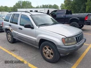 2002 Jeep Grand Cherokee with VIN 1J4GX38S92C237261, listed as a IAAI auction lot 42923904 with 112,640 mi miles and . Bid and sale history available at DreamBid. Image 1.