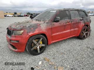 2012 Jeep Grand Cherokee SRT-8 z VIN 1C4RJFDJ7CC217641, wystawiony jako Copart lot #44060105 z przebiegiem 108 858 mil mil oraz Szkoda całkowita • Salvage title. Historia ofert i sprzedaży dostępna na DreamBid. Obrazek 1.