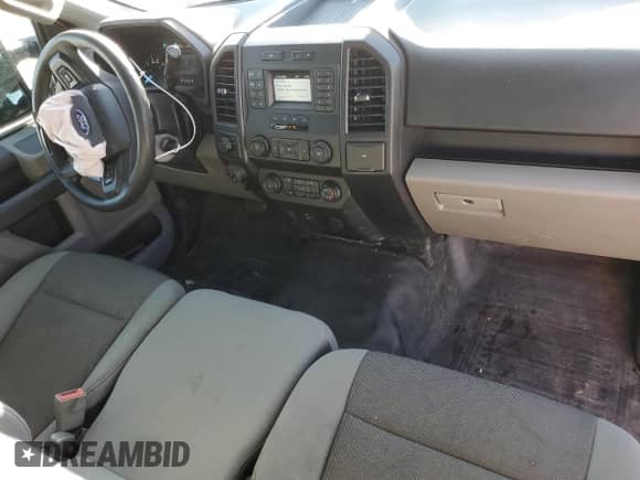 2019 Ford F-150 XL with VIN 1FTNF1C43KKE41153, listed as a Copart auction lot 84074044 with 179,684 mi miles and Salvage title. Bid and sale history available at DreamBid. Image 8.