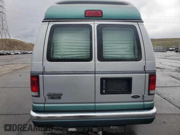 1999 Ford Econoline Cargo Recreational with VIN 1FDRE14L3XHA31771, listed as a Copart auction lot 49973795 with 220,268 mi miles and Salvage title. Bid and sale history available at DreamBid. Image 6.