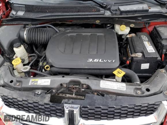 2013 Dodge Grand Caravan SE with VIN 2C4RDGBG1DR810845, listed as a Copart auction lot 71692425 with 179,838 mi miles and Salvage title. Bid and sale history available at DreamBid. Image 12.