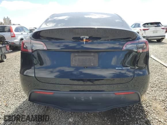 2022 Tesla Model Y Long Range with VIN 7SAYGAEE0NF340771, listed as a Copart auction lot 85189405 with 60,930 mi miles and Salvage title. Bid and sale history available at DreamBid. Image 6.
