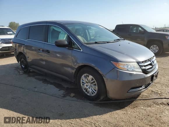 2014 Honda Odyssey LX z VIN 5FNRL5H25EB073844, wystawiony jako Copart lot #71624895 z przebiegiem 169 387 mil mil oraz Szkoda całkowita • Salvage title. Historia ofert i sprzedaży dostępna na DreamBid. Obrazek 4.