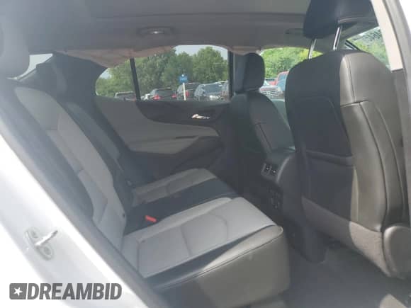 2018 Chevrolet Equinox Premier with VIN 2GNAXVEV1J6115823, listed as a Copart auction lot 69094645 with 106,508 mi miles and Salvage title. Bid and sale history available at DreamBid. Image 10.