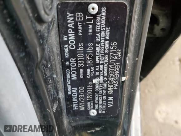 2000 Hyundai Accent with VIN KMHCG45G9YU127156, listed as a Copart auction lot 63414815 with 91,446 mi miles and Clean title. Bid and sale history available at DreamBid. Image 12.