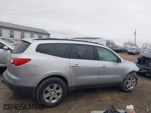 2012 Chevrolet Traverse 1LT with VIN 1GNKRGED8CJ100260, listed as a IAAI auction lot 41173915 with 214,686 mi miles and . Bid and sale history available at DreamBid. Image 14.