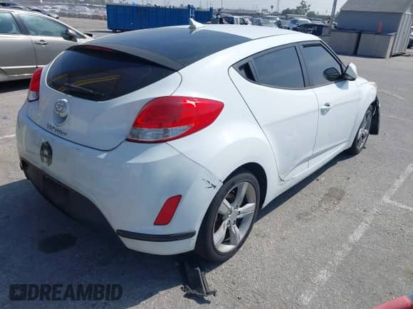 2014 Hyundai Veloster with VIN KMHTC6AD8EU209409, listed as a IAAI auction lot 42087236 with 124,459 mi miles and . Bid and sale history available at DreamBid. Image 4.