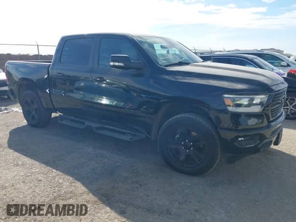 2021 Ram 1500 Lone Star z VIN 1C6RREFT9MN629588, wystawiony jako IAAI lot #41388994 z przebiegiem 85 508 mil mil oraz . Historia ofert i sprzedaży dostępna na DreamBid. Obrazek 1.