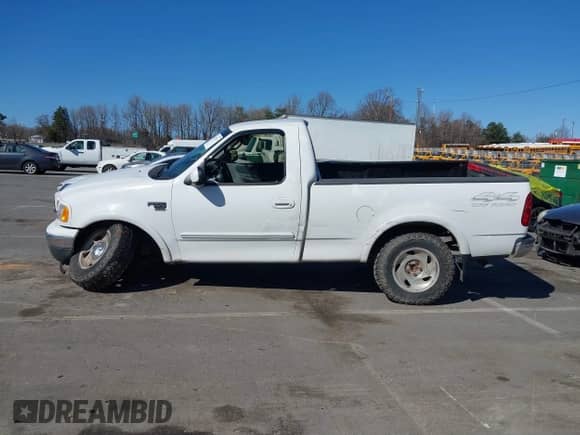 2000 Ford F-150 XL with VIN 1FTRF18W2YNB42014, listed as a IAAI auction lot 41827247 with Not provided miles and . Bid and sale history available at DreamBid. Image 14.