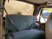 2001 Jeep Wrangler Sahara z VIN 1J4FA59S21P349009, wystawiony jako Copart lot #57588205 z przebiegiem 235 268 mil mil oraz Czysty tytuł • Clean title. Historia ofert i sprzedaży dostępna na DreamBid. Obrazek 11.