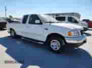 2003 Ford F-150 XL z VIN 2FTRX17L63CB07124, wystawiony jako Copart lot #86682935 z przebiegiem 101 788 mil mil oraz Szkoda całkowita • Salvage title. Historia ofert i sprzedaży dostępna na DreamBid. Obrazek 4.