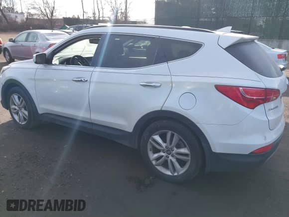 2016 Hyundai Santa Fe with VIN 5XYZWDLA4GG332545, listed as a IAAI auction lot 41478859 with 185,584 mi miles and . Bid and sale history available at DreamBid. Image 3.