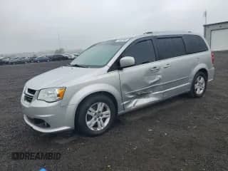 2012 Dodge Grand Caravan Crew with VIN 2C4RDGDGXCR377702, listed as a Copart auction lot 71827965 with 221,594 mi miles and Salvage title. Bid and sale history available at DreamBid. Image 1.