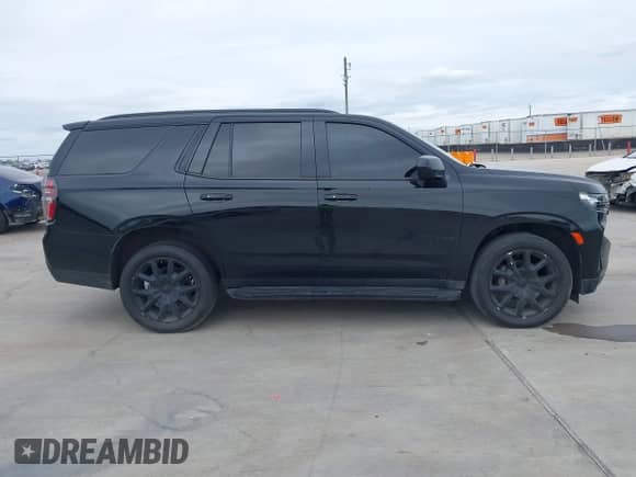 2023 Chevrolet Tahoe RST with VIN 1GNSCRKDXPR282973, listed as a IAAI auction lot 39018448 with 33,385 mi miles and . Bid and sale history available at DreamBid. Image 13.