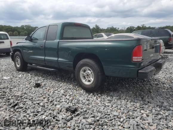 1999 Dodge Dakota SLT with VIN 1B7GL22X8XS283614, listed as a Copart auction lot 59412515 with 69,705 mi miles and Salvage title. Bid and sale history available at DreamBid. Image 2.