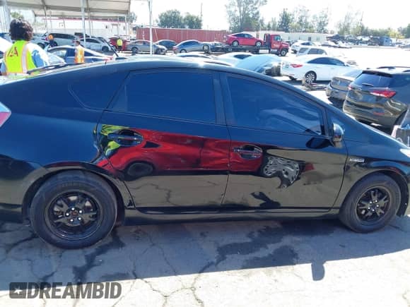 2015 Toyota Prius Four z VIN JTDKN3DU8F0411387, wystawiony jako IAAI lot #43043082 z przebiegiem 66 895 mil mil oraz . Historia ofert i sprzedaży dostępna na DreamBid. Obrazek 13.