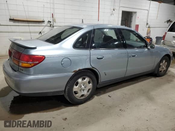 2001 Saturn LS with VIN 1G8JW54R11Y585435, listed as a Copart auction lot 82021364 with 153,436 mi miles and Salvage title. Bid and sale history available at DreamBid. Image 3.