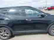 2016 Hyundai Santa Fe z VIN 5XYZUDLA9GG371704, wystawiony jako IAAI lot #42287648 z przebiegiem 118 442 mil mil oraz . Historia ofert i sprzedaży dostępna na DreamBid. Obrazek 13.