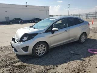 2011 Ford Fiesta S with VIN 3FADP4AJXBM207383, listed as a Copart auction lot 71039745 with 111,821 mi miles and Salvage title. Bid and sale history available at DreamBid. Image 1.