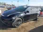 2022 Tesla Model Y Performance with VIN 7SAYGDEF7NF516418, listed as a IAAI auction lot 43222998 with 26,525 mi miles and . Bid and sale history available at DreamBid. Image 2.