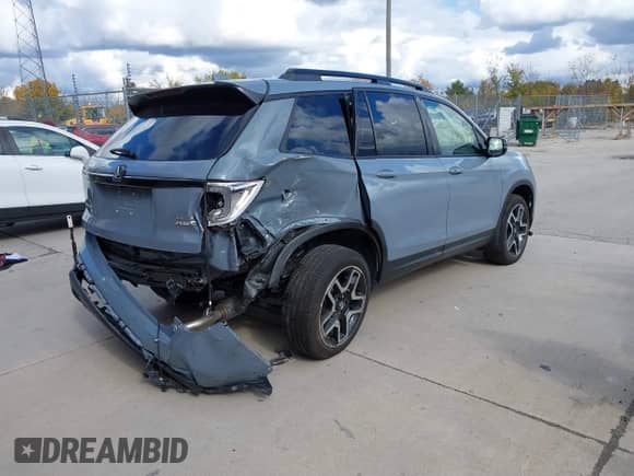 2023 Honda Passport Elite z VIN 5FNYF8H03PB000039, wystawiony jako IAAI lot #40593339 z przebiegiem 33 697 mil mil oraz . Historia ofert i sprzedaży dostępna na DreamBid. Obrazek 4.