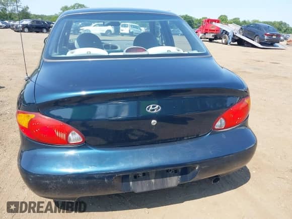 2000 Hyundai Elantra GLS z VIN KMHJF35F4YU967843, wystawiony jako IAAI lot #42817274 z przebiegiem 85 044 mil mil oraz . Historia ofert i sprzedaży dostępna na DreamBid. Obrazek 19.