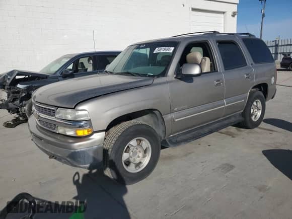2000 Chevrolet Tahoe LT z VIN 1GNEK13T8YJ198044, wystawiony jako Copart lot #54918695 z przebiegiem 190 834 mil mil oraz Czysty tytuł • Clean title. Historia ofert i sprzedaży dostępna na DreamBid. Obrazek 1.