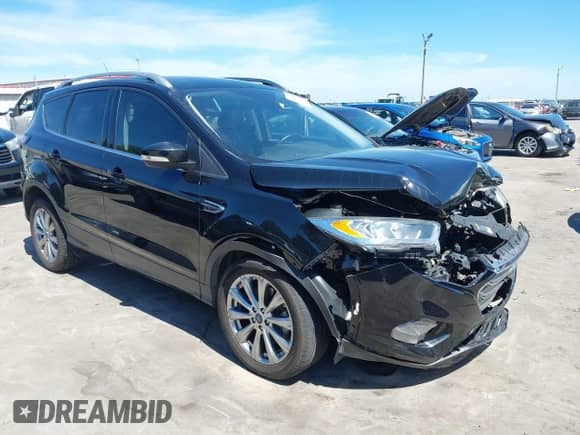 2017 Ford Escape Titanium with VIN 1FMCU0J97HUE26024, listed as a IAAI auction lot 42828848 with 67,634 mi miles and . Bid and sale history available at DreamBid. Image 1.