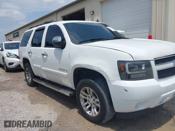 2007 Chevrolet Tahoe LTZ with VIN 1GNFC13JX7R256106, listed as a IAAI auction lot 42490456 with 436,354 mi miles and . Bid and sale history available at DreamBid. Image 6.
