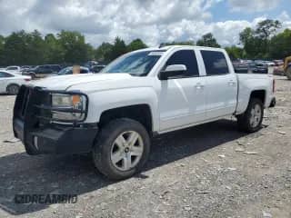2017 Chevrolet Silverado 1500 LT with VIN 3GCUKREC8HG143580, listed as a Copart auction lot 68869605 with 156,515 mi miles and Salvage title. Bid and sale history available at DreamBid. Image 1.