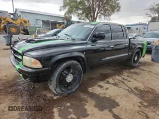 2001 Dodge Dakota Sport with VIN 1B7GL2AX31S176415, listed as a Copart auction lot 80581695 with 205,916 mi miles and Salvage title. Bid and sale history available at DreamBid. Image 1.