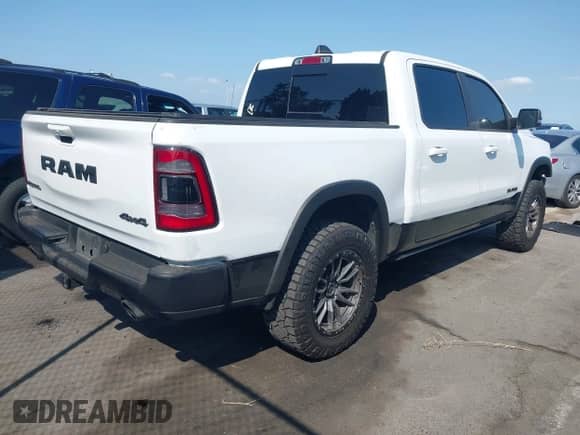 2020 Ram 1500 Rebel z VIN 1C6SRFLT5LN214584, wystawiony jako IAAI lot #43186902 z przebiegiem 82 036 mil mil oraz . Historia ofert i sprzedaży dostępna na DreamBid. Obrazek 4.