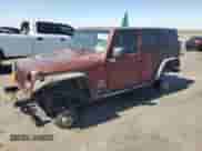 2007 Jeep Wrangler Unlimited Sahara z VIN 1J4GA59157L122909, wystawiony jako Copart lot #67484885 z przebiegiem Nie podano mil oraz Szkoda całkowita • Salvage title. Historia ofert i sprzedaży dostępna na DreamBid. Obrazek 1.