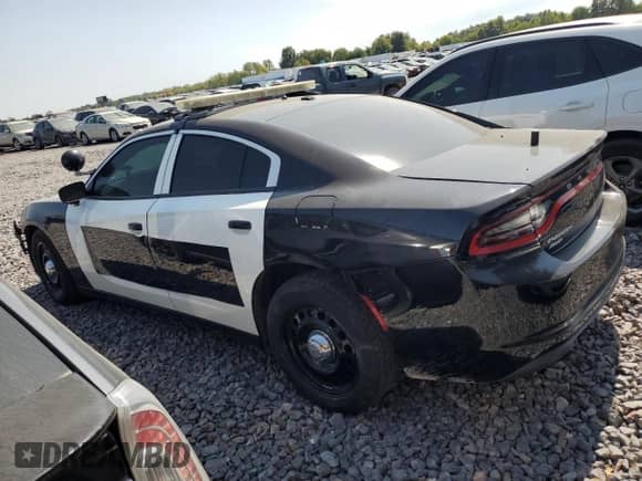 2015 Dodge Charger Police z VIN 2C3CDXKT6FH748911, wystawiony jako Copart lot #70547445 z przebiegiem 176 923 mil mil oraz Szkoda całkowita • Salvage title. Historia ofert i sprzedaży dostępna na DreamBid. Obrazek 2.