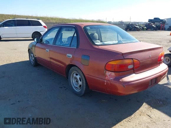 1998 Chevrolet Prizm z VIN 1Y1SK5288WZ409169, wystawiony jako IAAI lot #41407451 z przebiegiem 129 273 mil mil oraz . Historia ofert i sprzedaży dostępna na DreamBid. Obrazek 3.