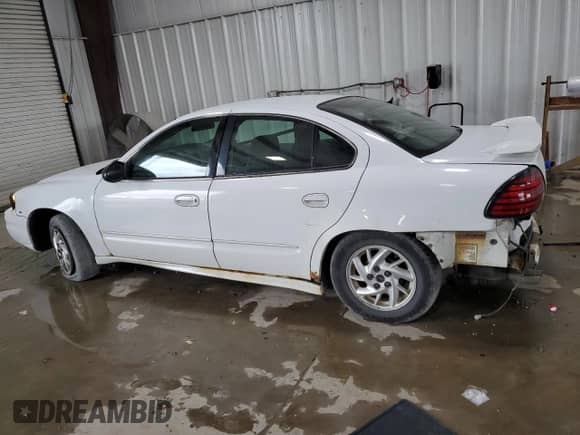 2004 Pontiac Grand Am SE1 with VIN 1G2NF52E84M669999, listed as a Copart auction lot 70597345 with 186,803 mi miles and Salvage title. Bid and sale history available at DreamBid. Image 2.