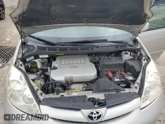 2007 Toyota Sienna XLE z VIN 5TDZK22C67S001018, wystawiony jako Copart lot #84058945 z przebiegiem 248 557 mil mil oraz Czysty tytuł • Clean title. Historia ofert i sprzedaży dostępna na DreamBid. Obrazek 12.