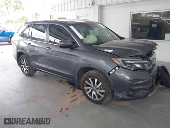 2021 Honda Pilot EX-L z VIN 5FNYF5H53MB030907, wystawiony jako IAAI lot #42454010 z przebiegiem 153 125 mil mil oraz . Historia ofert i sprzedaży dostępna na DreamBid. Obrazek 1.