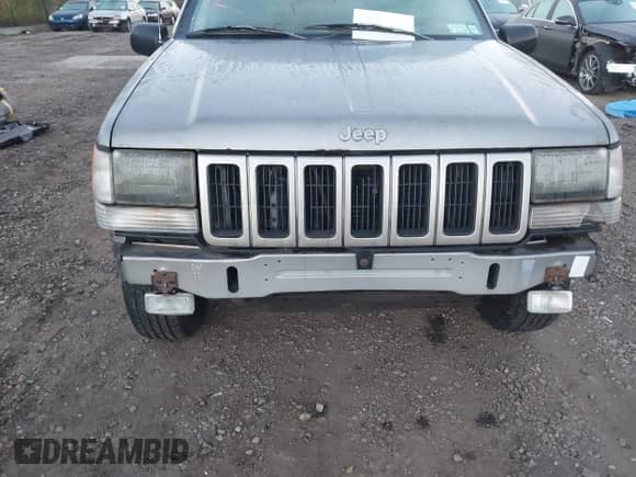 1997 Jeep Grand Cherokee Laredo with VIN 1J4GZ58YXVC765227, listed as a IAAI auction lot 43518719 with 97,000 mi miles and . Bid and sale history available at DreamBid. Image 6.