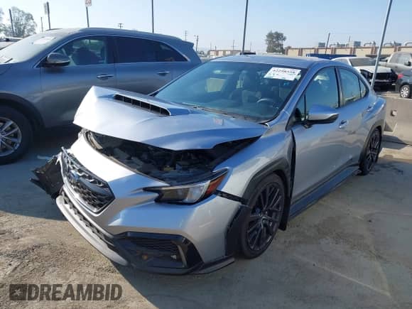 2022 Subaru WRX Premium with VIN JF1VBAF66N9031229, listed as a IAAI auction lot 42298558 with 14,084 mi miles and . Bid and sale history available at DreamBid. Image 2.