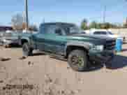 2001 Dodge 1500 z VIN 1B7HF13Z31J268988, wystawiony jako Copart lot #76898534 z przebiegiem 282 915 mil mil oraz Szkoda całkowita • Salvage title. Historia ofert i sprzedaży dostępna na DreamBid. Obrazek 4.