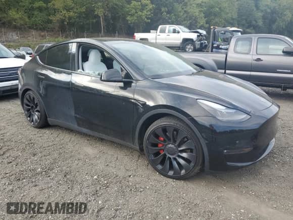 2023 Tesla Model Y Performance with VIN 7SAYGDEF0PF808883, listed as a Copart auction lot 82106605 with 22,706 mi miles and Salvage title. Bid and sale history available at DreamBid. Image 4.