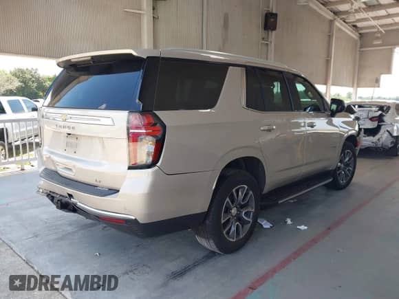 2021 Chevrolet Tahoe LT z VIN 1GNSCNKD0MR410612, wystawiony jako IAAI lot #43081370 z przebiegiem 144 805 mil mil oraz . Historia ofert i sprzedaży dostępna na DreamBid. Obrazek 4.