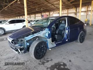 2023 Tesla Model Y Long Range z VIN 7SAYGAEE2PF582870, wystawiony jako Copart lot #86654875 z przebiegiem Nie podano mil oraz Szkoda całkowita • Salvage title. Historia ofert i sprzedaży dostępna na DreamBid. Obrazek 1.