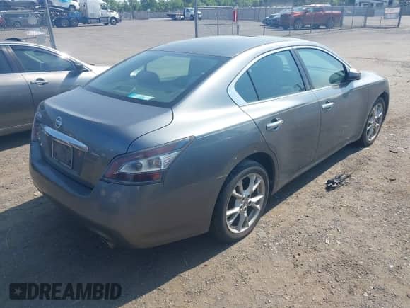 2014 Nissan Maxima SV z VIN 1N4AA5AP7EC906006, wystawiony jako IAAI lot #42411784 z przebiegiem 192 504 mil mil oraz . Historia ofert i sprzedaży dostępna na DreamBid. Obrazek 4.