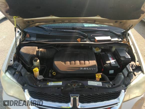2013 Dodge Grand Caravan SE with VIN 2C4RDGBG0DR535890, listed as a IAAI auction lot 40304162 with 134,857 mi miles and . Bid and sale history available at DreamBid. Image 10.