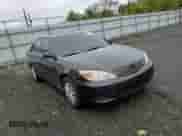 2002 Toyota Camry LE with VIN 4T1BE32K72U508340, listed as a Copart auction lot 86317005 with 216,628 mi miles and Salvage title. Bid and sale history available at DreamBid. Image 13.