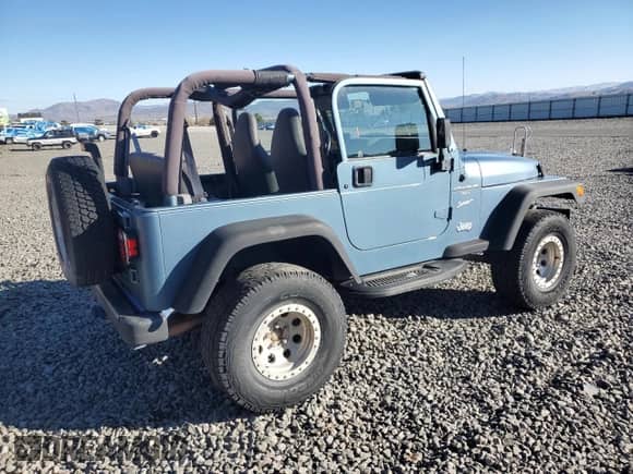 1999 Jeep Wrangler Sport with VIN 1J4FY19S1XP455674, listed as a Copart auction lot 86821605 with 218,356 mi miles and Clean title. Bid and sale history available at DreamBid. Image 3.
