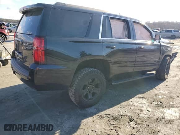 2019 Chevrolet Tahoe LS z VIN 1GNSCAKCXKR375025, wystawiony jako Copart lot #86078054 z przebiegiem Nie podano mil oraz Szkoda całkowita • Salvage title. Historia ofert i sprzedaży dostępna na DreamBid. Obrazek 3.